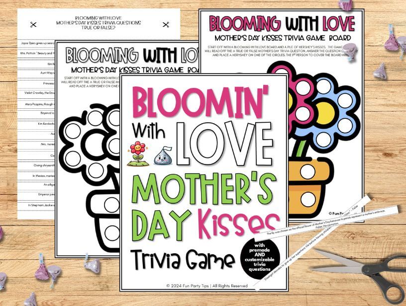 Overhead-view-of-a-Mother's-Day-trivia-game-board-and-question-sheets-with-scissors-and-Hershey's-kisses