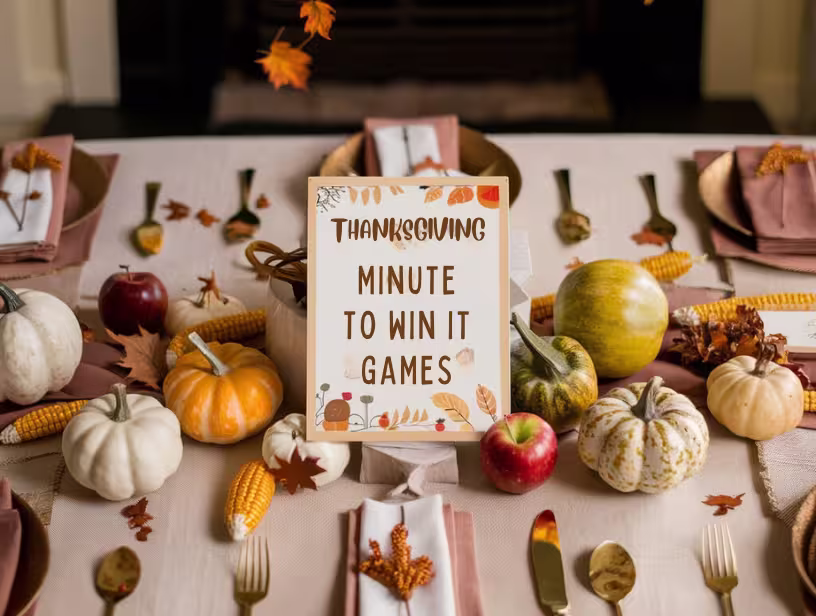 Thanksgiving-dinner-table-decorated-with-mini-pumpkins-and-a-sign-for-Thanksgiving-Minute-to-Win-It-Games.