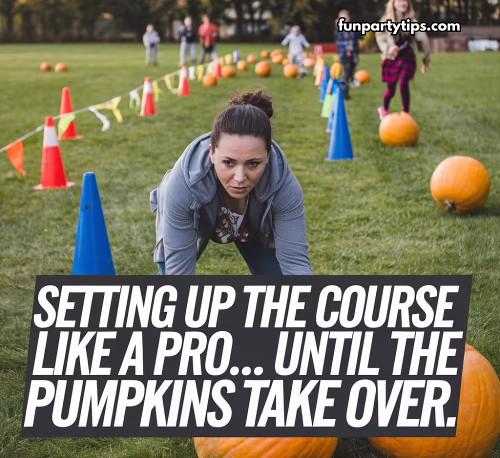 A-woman-crouches-on-a-grassy-field-setting-up-an-obstacle-course-for-a-pumpkin-roll-relay,-demonstrating-the-preparation-behind-this-fun-fall-game-that-entertains-participants-of-all-ages.