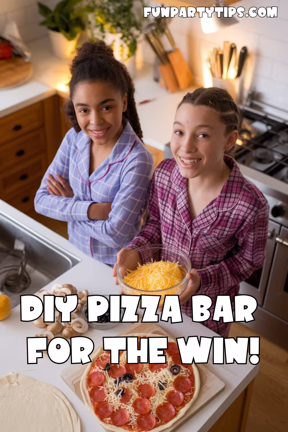 Two-girls-in-pajamas-smiling-in-the-kitchen-while-preparing-a-DIY-pizza,-one-holding-a-bowl-of-cheese. The-text-reads,-"DIY-Pizza-Bar-for-the-Win!"-showcasing-a-delicious-and-frugal-sleepover-idea-that-turns-cooking-into-a-fun,-low-cost-activity.